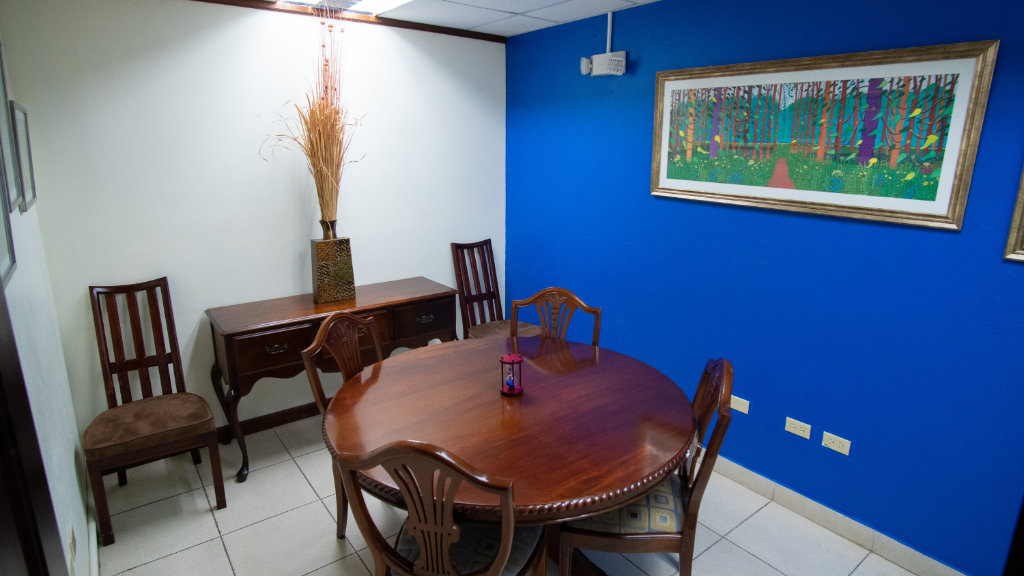 Book a 4 seater Meeting room available hourly or daily at The Business District's Old Hope Road location.